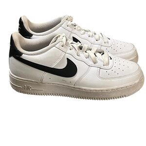 Nike Air Force 1 white leather and black swoosh lace up sneakers